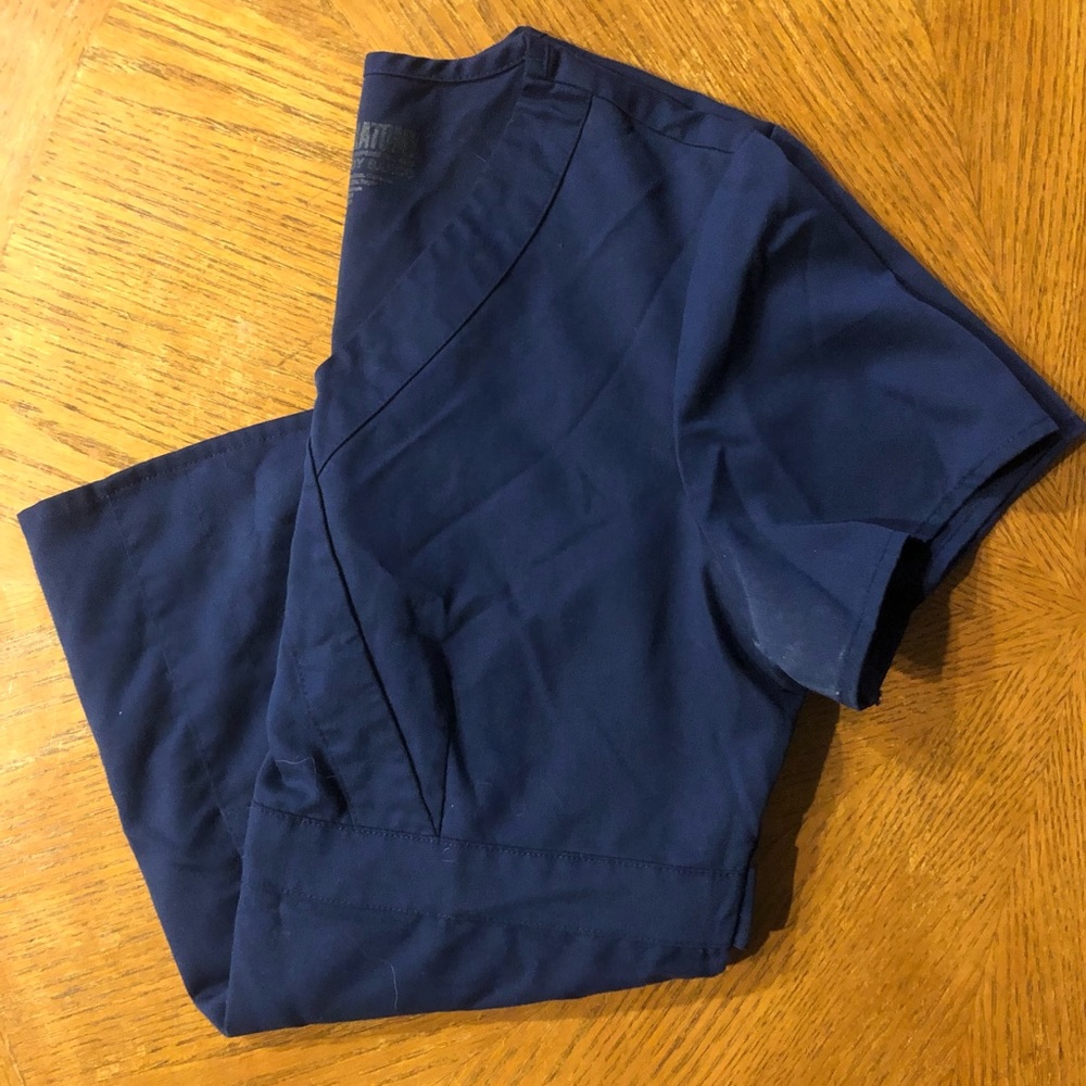 Navy Greys Anatomy scrub top with flattering adjustable waist detail!